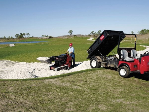 Compact utility loaders tee up golf course maintenance