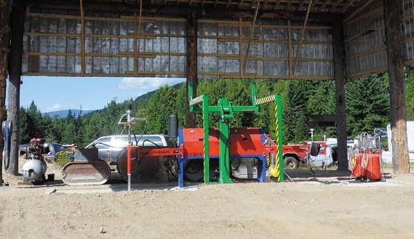 The drainage structure where Balfour Towing houses its SEDA Easy Drain fluid evacuation system, is built from tree trunks, recycled drift pins, log chokers, rebar and recycled siding.