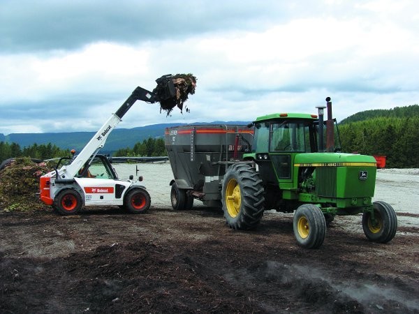 A telehandler, shown here loading a Supreme EnviroProcessor at Stanhope Dairy in Saanich, B.C.