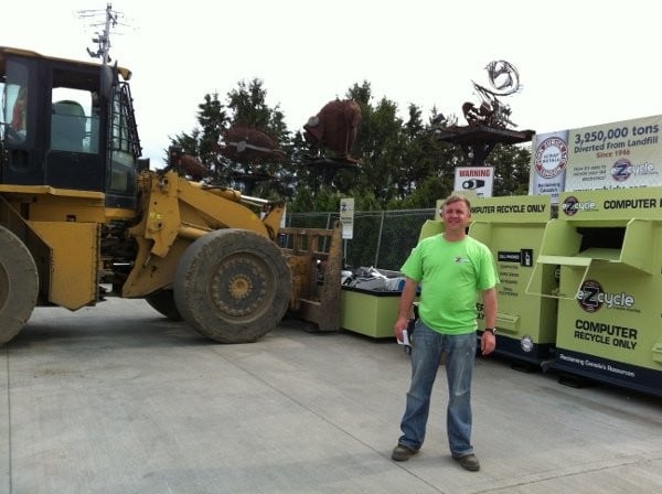 Matt Zubick in front of his eZcycle bins, at John Zubick Ltd, London, Ontario.