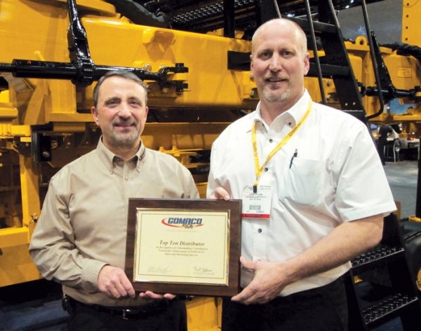 From left: Bob Leonard, GOMACO United States and Canada Sales Manager; and Chris Brown, Asphalt Concrete Equipment &amp; Supplies.