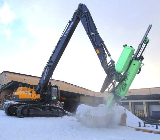 A Volvo EC480D crawler excavator adapted for drilling.