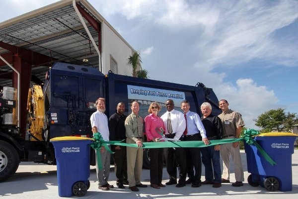 City of Fort Pierce Mayor Linda Hudson cuts the Grand Opening ribbon to celebrate Waste Management’s Fort Pierce Transfer Station with Doug Davis, Richard K. Davis Construction; City of Fort Pierce Deputy City Manager Nick Mimms; Waste Management Government Affairs Director Jeff Sabin; Hudson; Florida State Representative Larry Lee; Commissioner Tom Perona; Okeechobee County Commissioner Bryant Culpepper; and Waste Management Operations Director Bryan Tindell.   Photo by Mitch Kloorfain