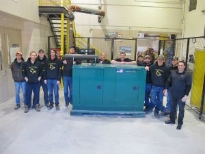 Electrical Power Generation students and Wajax representatives pose with the new 30-kw propane generator donated by Wajax: (l-r) Elliot Jenden-Selway, Pieter Schinkelshoek, David Schinkelshoek, Dan Rolling, Robert Riddell, Bill Fields (Wajax), Rick Schmidt (Wajax), John Putnins, Mike Gallant, Steve Storrey, Ian Davis, Jerry Curtis (Wajax).