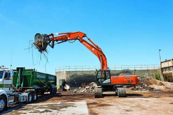 Standard Industries, at its core a scrap recycling company, sends their fleet of Hitachi excavators to work on demolition projects - an excellent source of scrap.