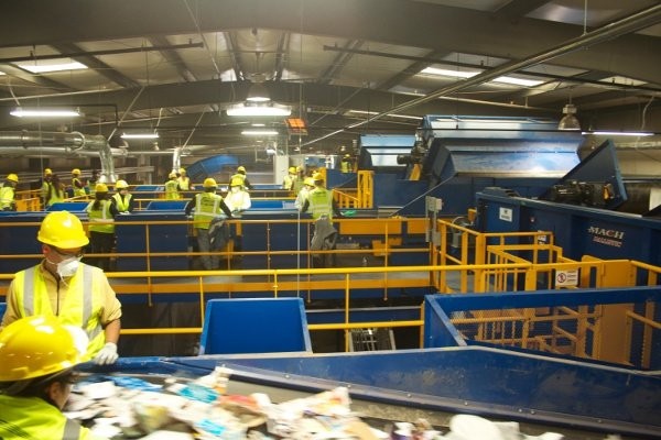 Inside the American Disposal facility at Manassas. Machinex 30-tons-per-hour single stream system includes an OCC Screen, Scalping Screen, Two Mach News Screen, MACH Ballistic separator, magnet, eddy current, plastics optical Sorters, single and 2-ram balers.