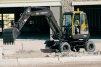 Volvo wheeled compact excavator for road work