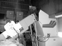 Grinder feed conveyor