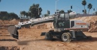 Telescoping-boom excavator has on- and off-road mobility