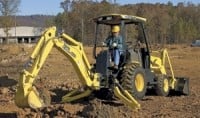 Compact backhoe loader has self-levelling bucket