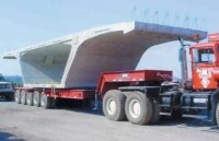 Trailers haul 100-ton bridge segments