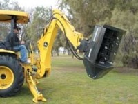Brush shredder attaches to small excavator or backhoe