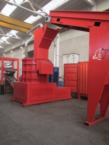 Densification plant for pre-shredded metal scrap