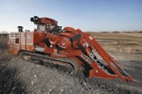 Large-track trencher digs in both rock and dirt