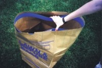 Yard waste bag accessory relieves frustration