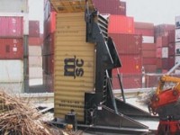 Container Tilter picks up and angles containers to 90 degrees