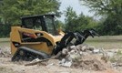 Industrial grapple rakes equip compact loaders for demolition
