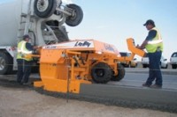 Concrete curber smoothly pours tight 24-inch radius