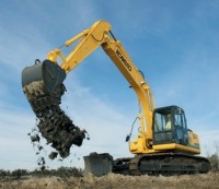 Kobelco excavator provides digging and dozing Kobelco excavator provides digging and dozing