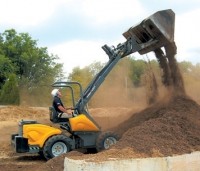 Compact utility loader uses telescopic arm