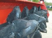 Mulcher attachments for skid-steer loaders