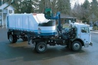 SEMI-TRAILER MOUNTED AUTOMATED SIDE LOADER