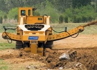 Wheel trencher digs to nine feet deep