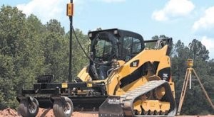 Accurate laser-based automated grading system for skid steers and compact loaders