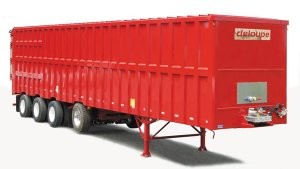 Tapered trailer with self-unloading floor