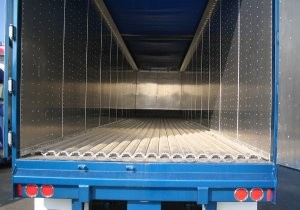 Impact resistant trailer unloading system designed for difficult loads