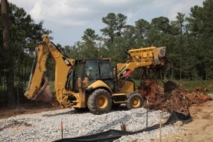 450F Backhoe Loader design enhancements include more power, efficient electronic control, added operator amenities, and easier serviceability