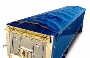 Electric Side Roll provides load security for waste haulers Electric Side Roll provides load security for waste haulers