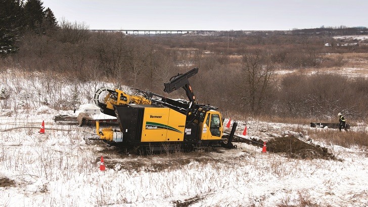 Vermeer's D100x140 Navigator horizontal directional drill successfully navigated the stone and cobble beneath the Little Saskatchewan River. Vermeer's D100x140 Navigator horizontal directional drill successfully navigated the stone and cobble beneath the Little Saskatchewan River.