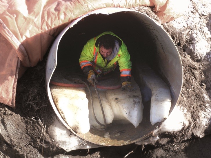 The smallest culvert rehabilitated was filled with ice, which had to be melted out with hot, glycol-filled hoses. The smallest culvert rehabilitated was filled with ice, which had to be melted out with hot, glycol-filled hoses.