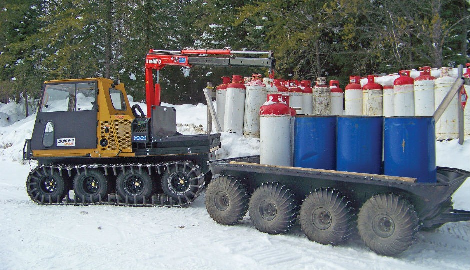 ARGO 8x8 Centaur equipped with Maxilift crane and flat bed, loading an ARGO 8 wheel trailer.