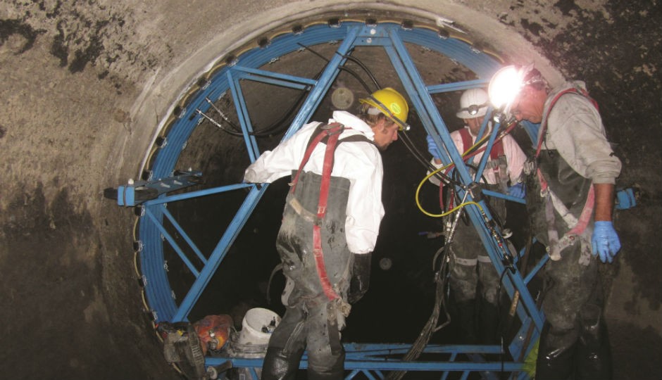 Workers install Logiball’s 108-inch main line packer at a job in Granite City, IL. Seasonally high groundwater has had a negative effect on underground facilities. A large sewer rehabilitation project rehabilitated 15,600 lineal feet of concrete pipe. Workers install Logiball’s 108-inch main line packer at a job in Granite City, IL. Seasonally high groundwater has had a negative effect on underground facilities. A large sewer rehabilitation project rehabilitated 15,600 lineal feet of concrete pipe.