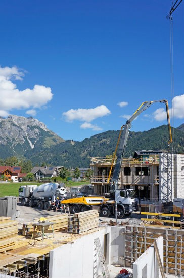 The Liebherr truck-mounted concrete pump 37 Z4 XXT during operation