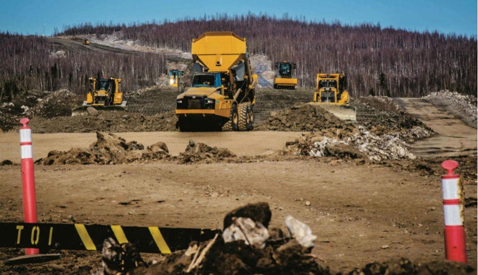 Working on the Inuvik to Tuktoyaktuk highway. (Photo courtesy of the Government of the Northwest Territories.)