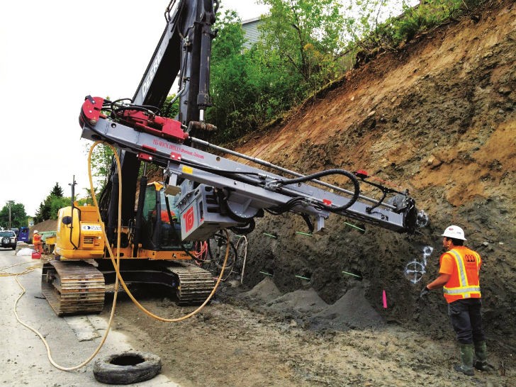 Excavator Mast and Top Hammer Solve Complex Geotechnical Drilling Challenge  