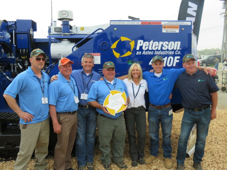 Tom Barry of Barry Equipment proudly accepts the Peterson 2014 Dealer of the Year award. L to R: Randy Earle, Mike Conway, Charlie Bagnall (Peterson), Tom Barry, Trish Barry, Joseph Barry, and Bryan Morris.