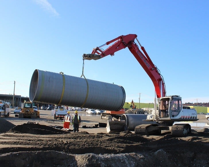 Delivered from the recently opened ADS distribution yard in Abbotsford, a 6-meter (20-foot) long section of large diameter SaniTite HP pipe is moved into place for a nearby mega-mall project. 