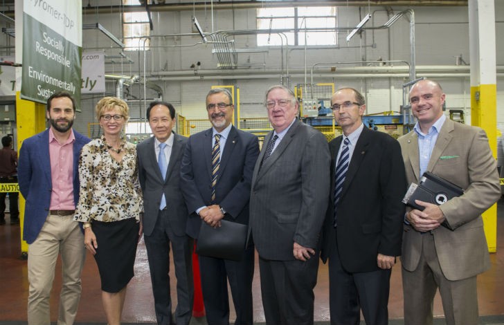 "Dignitaries at Tyromer Open House pose in front of the facility (CNW Group/Ontario Tire Stewardship)". 