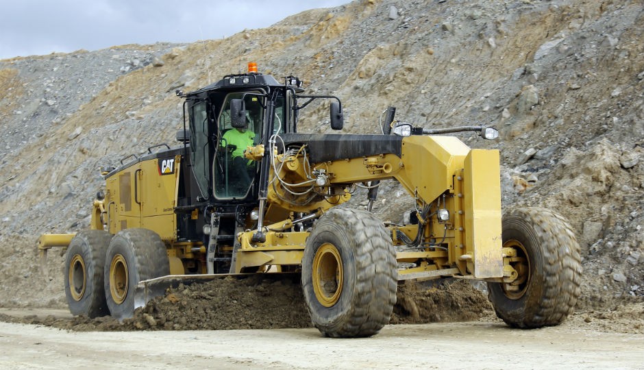 Cat 18M3 Motor Grader dresses haul road