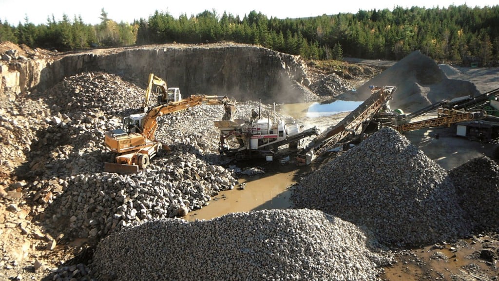 Two Liebherr wheeled excavators feed a Nordberg crusher.