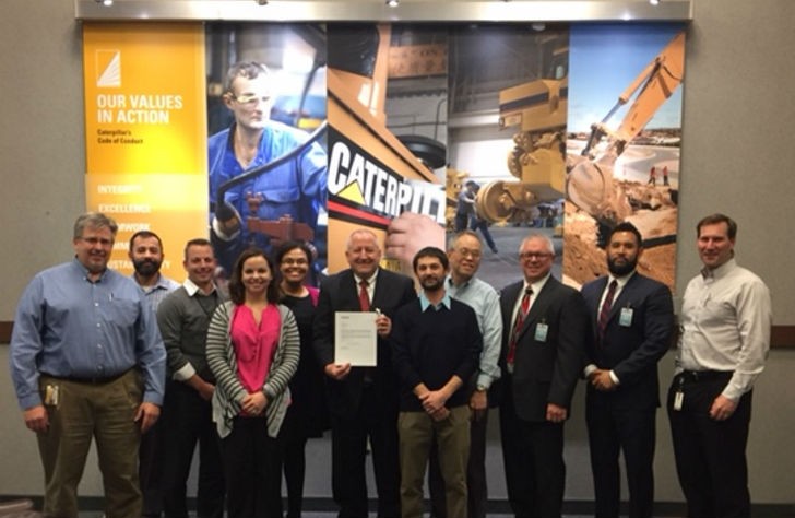 Yokohama and Caterpillar personnel with the supplier award: L-R Timothy Bennett, David Colantoni, Adam Ofisher, Megan Braun, Staci Abron, Andrew Zeisser, Chris Formhals, Choi Wong, Mike Pastwick, Tsuyoshi Johnson, Trent Cleveland.