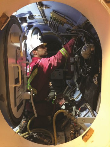 A member of the hyperbaric intervention support team, inside the airlock. The workers are often certified commercial divers. A member of the hyperbaric intervention support team, inside the airlock. The workers are often certified commercial divers.