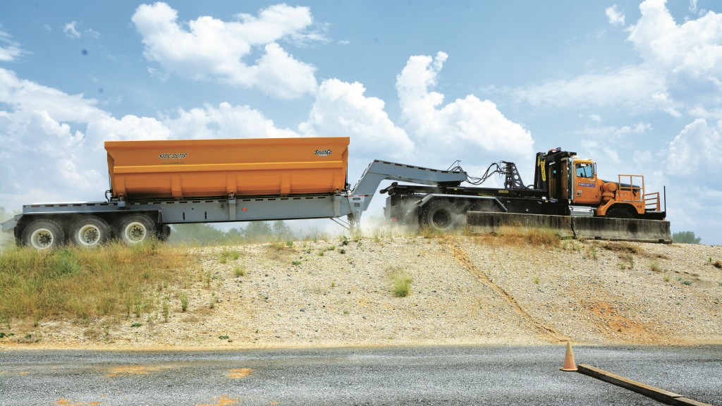 The Western Star 6900XD Offroad MBT-40 can change bodies in minutes, going from fifth-wheel tractor (above) to a dump truck (bottom 1st image) to a water truck (botton 2nd image), each with fully functioning hydraulics and in-cab switches.
