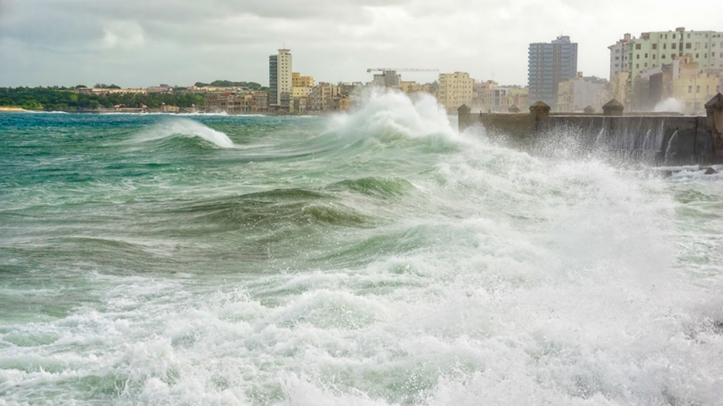 Storm surge attacks a seawall protecting coastal city. Storm surge attacks a seawall protecting coastal city.