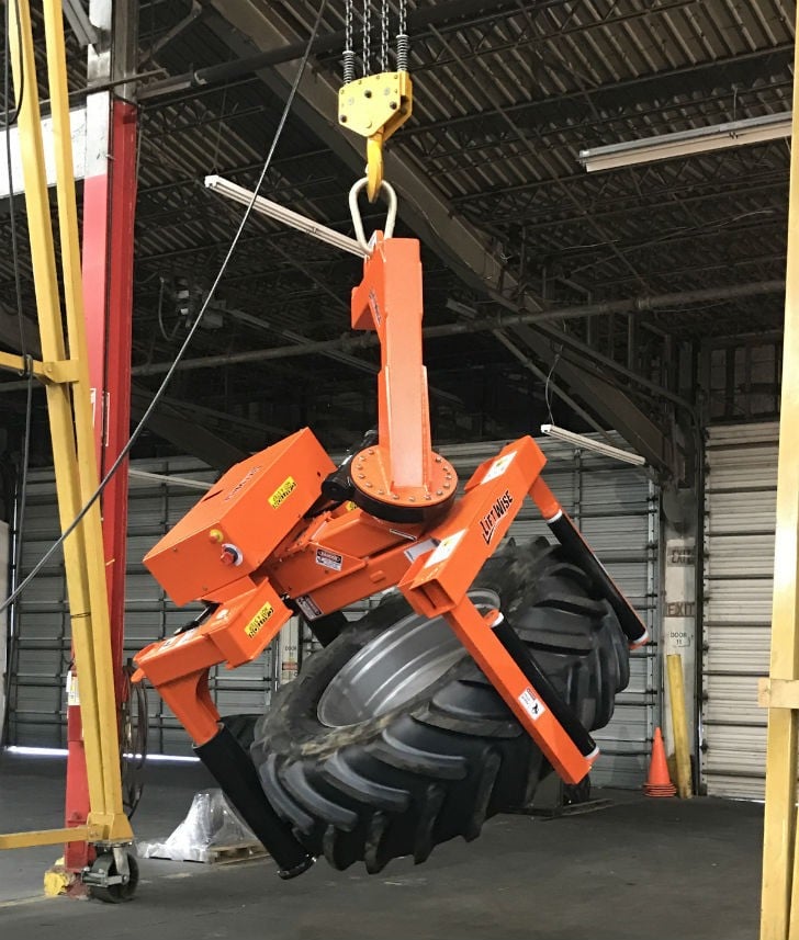 The SideWinder can lift a tire from a flat position and rotate it continuously to vertical for installation. 