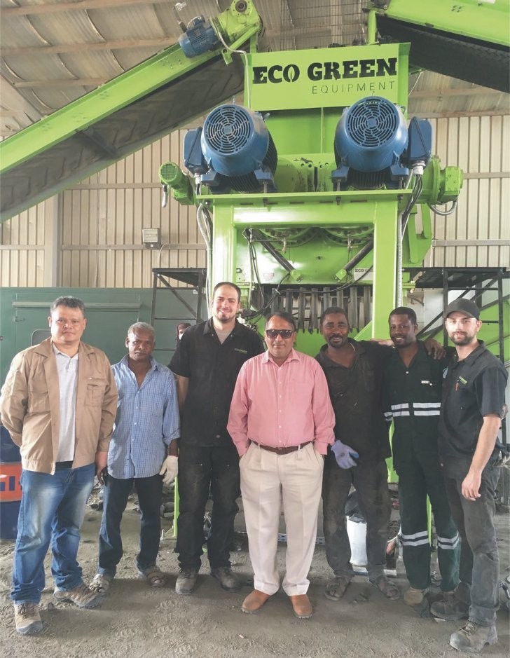 Uday Gautam, Manager of NRC (centre) and his team with their new ECO Green Giant two-shaft primary tire shredder system, along with ECO Green service technicians Ben Rogers (third from left) and Jarom Groat (far right).